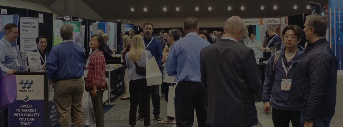 A pixelated laptop with a hand touching a play button